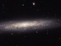 Hubble Catches a Dusty Spiral in Virgo This magnificent new image taken with the  NASA/ESA Hubble Space...