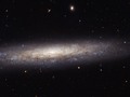 Hubble Catches a Dusty Spiral in Virgo This magnificent new image taken with the NASA/ESA Hubble Space...