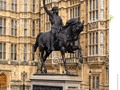 A statue or Richard 1 of England (also known as Richard the Lionheart} at the Palace of Westminster in London.