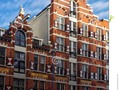 An example of a historic warehouse on the side of one of Amsterdam's canals. #amsterdam #architecture #brick