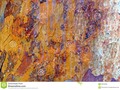 a colourful rain streaked tree trunk, which may be suitable as a background or texture. #abstract #background