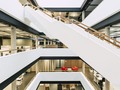 An eye-catching staircase is the focal point of this atrium. #coolbuildings #interiors