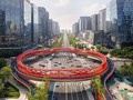 #ArchitectureNow  The Ring of Jiaozi  The Jiaozi Ring is located directly opposite the twin towers of Chengdu’s Financial City. It is of course, China red. The unique network structure on the bridge has a flexible looking design, like string. The Jiaozi Ring is the first pedestrian overpass with ‘multiple functions’ in China.  "The Ring of Jiaozi is based on the world's first paper currency "Jiaozi" born in Chengdu during the Southern Song Dynasty. Its overall shape is derived from the copper money pattern on the Jiaozi banknotes. The design uses an elegant curve to show the paper. Gentle." said Lu Rui, chief planner of the Architecture and Landscape Institute of Sichuan Architectural Design and Research Institute. Photography: @nickkuratnik  . #architect #officedesign #archilovers #concept #design #architecture #luxury #archimodel #luxurylife #interiordesign #futurearchitects2050 #instagood #modern #design_vision #architecturalproject #instatravel #contemporary #amazing #archimodel #archidesign #lovearchitecture #architectureschool #archgram #arquiteta #architecttura #designfuture  #construction #usa