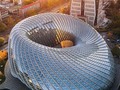 Phoenix Center designed by the Beijing Institute of Architectural Design (BIAD) is wrapped in latticed glass and steel skin to enunciate the “Mobius Strip” shape of which its design is based on. Completed as of 2012  📍Beijing, China.  📷 @jimmylin03 & @rebus_______ __________ #ArchitectureNow All materials presented on this site are Ⓒcopyrighted and owned by the creators listed above.