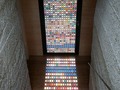 This stained glass door by Architect Armin Blasbichler is made up of hundreds of pantone swatches!  __________ #ArchitectureNow All materials presented on this site are Ⓒcopyrighted and owned by the creators listed above.