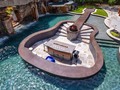 The client wanted to incorporate his love of music into his Insane Pool. This backyard has so many features, including a guitar shaped pool, a massive rock grotto with waterfalls, multiple fire features, a swim-up bar, a huge spa with a built-in bar and musical chairs, an area for live bands to set up and perform, and an outdoor kitchen with a bar. Tag a rockstar or band you think needs this backyard! Design by @lucaslagoons __________ #ArchitectureNow All materials presented on this site are Ⓒcopyrighted and owned by the creators listed above.