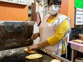 Doña Estela makes the best quesadillas and pambazos. She closed her stall on March 19th, now she is open again. Yesterday we had dinner with her and she asked me to take her picture working, right next to the comal.   This is a hard working woman who loves her job, every time I visit her she takes time to show me her mushrooms, -look how beautiful they are - she says while she hands me a spoonful of perfect mushrooms, she talks about her veggies as if they were her grandkids.  Doña Estela took some time to sit with us, when I asked for the bill she was like... -Are you not having your usual flan Roci?- And of course I had the flan, how can you say no to Doña Estela? She then proceed to tell us some childhood stories.   - I don’t like sweets, when I was little all the kids used to have those big 5cents coins, I wanted one to buy my favorite lemon cookies, the big ones, those were the best. But we didn’t have any money so my mom gave me fruit, some apples or Limas. I love fruit but never got hooked with sweets like the other kids, it was not by choice but it is what it is. -  Doña Estela is from Pinotepa Nacional a town in Oaxaca. She spent the pandemic there, visiting her family and remembering her childhood. She has money now after 26 years working hard making quesadillas, but life is tricky and the lemon cookies that were so desirable before now doesn’t appeal to her, she prefers savory dishes like rice with fried eggs and of course tortillas. - I can live without bread, but never without tortillas, tortillas are the best- she says while she fixes her apron.   And we left happy and with a full belly, I told my boyfriend that Doña Estela wants us to have children. She wants to be their nanny while I work on the tours. We don’t want kids and I never have the heart to tell her this, but I appreciate that she is willing to take care of my imaginary children so I can continue working with Eat Like a Local’s guests. At the end, this is what life is about, having a community that takes care of you, feeding you amazing mushrooms, taking care of your future children or making sure you don’t forget to eat your flan.   #doñaestela #flan #mexicanwoman #mexico #womenpower