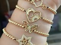 Hermosas pulseras con dije de zircón y balines de acero