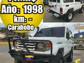 🏯▪Ubicación: VALENCIA 💰▪Precio: 14.000$ 📨▪Teléfono: 04124581205 👷▪Instagram: @zonadeautos2023 🔩▫Marca: TOYOTA 🚘▫Modelo: MACHITO 📆▫Año: 1998 📟▫Km: - 🔧▫Transmisión: SINCRONICA 📥▫Acepta Cambio: SI 💳▫Extra: FULL AIRE ACONDICIONADO, PAPELES AL DÍA, FULL SONIDO CON 18 MEDIOS Y 4 BAJOS, NUNCA CHOCADO, RECIBO VEHICULO COMO PARTE DE PAGO Y DIFERENCIA. 📖▫Unico Dueño: NO 🔔▫Fallas: NINGUNA ________________________ ▪︎Ver publicaciones del mismo Modelo Pulsa Aqui 👉 #TucarroVendeloMachito 👈 ▪︎Ver publicaciones de la misma  Marca Pulsa Aqui  👉 #TucarroVendeloToyota 👈 ▪︎Ver mas Autos en el mismo estado 👉 #TuCarroVendeloCarabobo 👈 _____________________