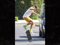 Justin Bieber Skateboarding Through New Neighborhood