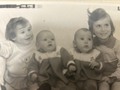 A much younger me. Second from right. The only baby picture I have of me. 1975.