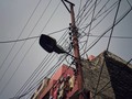 Wired Up #india #noida #wires #telephonepole #streetlight #lookingup #cityscape #bigcity #dryinglaundry