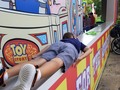 My son waiting for his mother and sister to get back from the roller-coaster