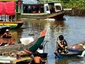 Everyone clears the way for the afternoon ferry from Chong Kneas across the Tonle Sap to the Mekong river and up to Phnom Penh Cambodia.