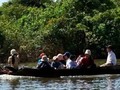 School Bus = longtail boat in the floating city of Chong Kneas Cambodia. These high school students go by boat up the Tonle Sap to the Siem Reap river and up to Siem Reap city to attend school.