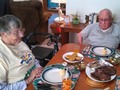 Poppi and Grandma sitting down to Father's Day dinner.
