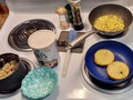 Today's Brekkie:  Deconstructed #Breakfast #Sandwiches Steel-Cut Oats w/Raisins Kinda weird weather outside & kinda weird #Brekkie inside ... Let's begin with the #oatmeal, it's easiest to explain. Roaming around grocery store last evening I pass the clearance-corner coming face-to-face with a container of #SteelCutOats 60%OFF b'cuz somebody dropped it hard on edge crushing it so plastic lid has to be taped on, but inner seal still intact (and I was able to uncrush cylinder and restore original shape such that lid fits again!) which many around me on farcebook tout as yummy. I was in need of more oatmeal after several oatmeal brekkies in pas weeks, so 2 bucks instead of $5-7 normally for organic steel-cut and less than my usual wholegrain rolled oats, I thought I'd take the Steel-Cut for a test drive (and could make cookies for holiday gifts if I didn't like them). So I fixed a small serving, added some Raisins, and ... ok, not bad, definitely edible, I still prefer the mouth (consistently) of the whole oats to these chopped groats ... I'll probably eat half the container and bake the rest. Now to #deconstructing brekkie sandwiches ... ya'know those frozen egg/meat/cheese on biscuit/muffin/croissant thingies? Well I found a couple hiding in my freezer, a convenience when time is short and brekkie will be on the run. This morning I just wasn't in a mood for a nuked egg-crois-mac-sandwich, but wanted to get them rotated outta freezer and thoughts of an easy #sausage and #gravy and #biscuit was forming ... separating the elements, I diced the sausage patties and started browning them with some chopped onion. Slightest smear of butter to biscuits cut sides (biscuits were actually #croissants) and toasted. A sprinkle of flour to sausage & onions to make a roux, with ⅓c each chicken broth and milk stirred in to make gravy. Diced the egg patties, added to sausage gravy. Serve up oats with pat of butter and sprinkle of stevia, then line bowl with biscuits, pour sausage & egg gravy over, cover with the remaining cheese slices.
