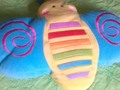 Cojín tipo peluche de mariposa... 5$