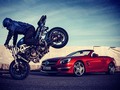 Pure Emotions!!! The insane Mercedes-Benz SL 63 AMG and the german stunt biker Julien Pohl (@julienpohl). taken by @marioroman_pictures . #mbfanphoto #mercedes mercedesbenz #benz #amg #sl #roadster #car #instacar #stunt #wheelie #hamburg #red #convertible #cabriolet #v8 #biturbo #blue